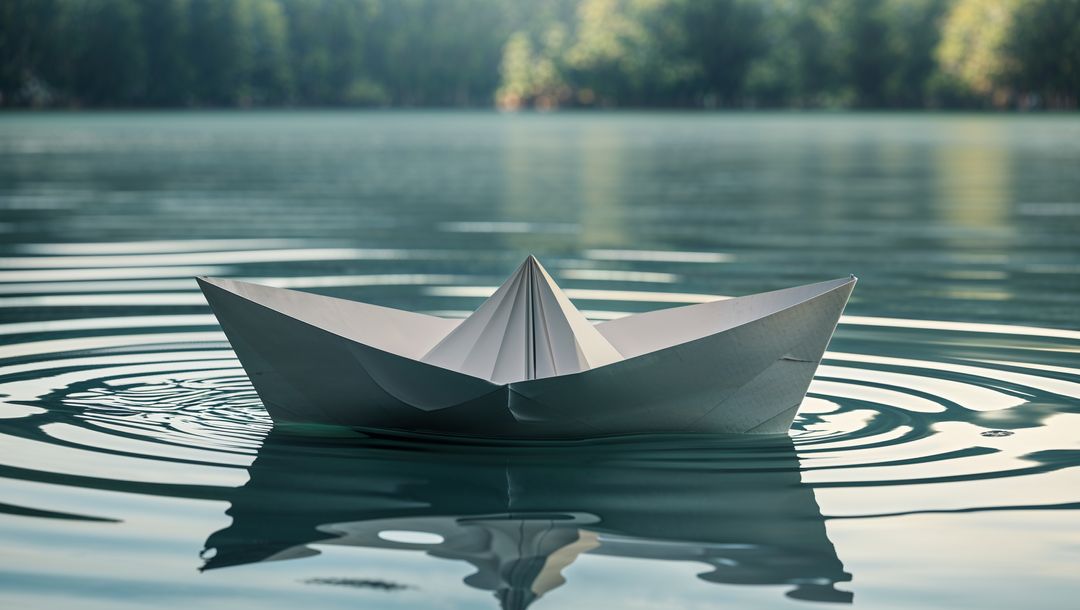 Serene Paper Boat Floating on Calm Lake