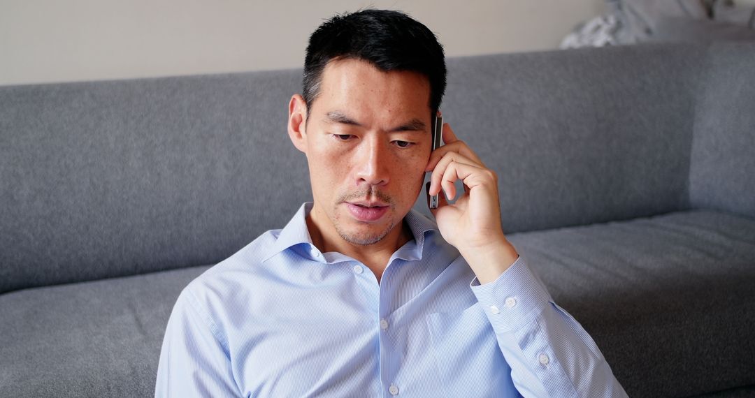 Man Talking on Mobile Phone in Casual Setting