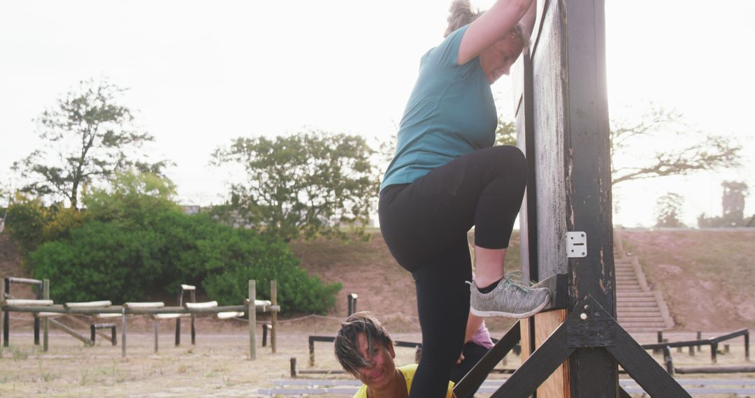 Women Overcoming Obstacle on Outdoor Fitness Course - Free Images, Stock Photos and Pictures on Pikwizard.com