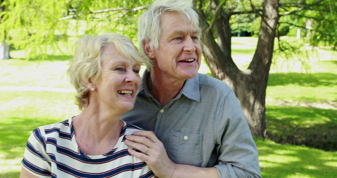 Smiling Senior Couple Enjoying Outdoors Together - Free Images, Stock Photos and Pictures on Pikwizard.com