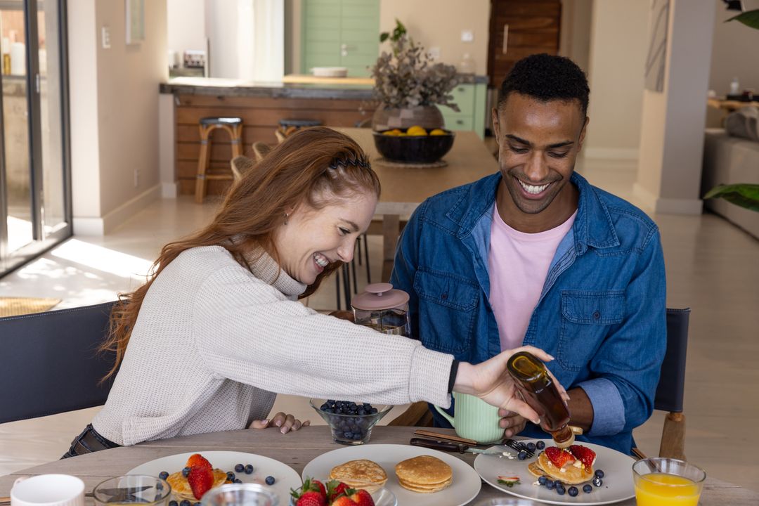 Culinary Enjoyment with Syrup Pancakes for Happy Couple at Breakfast