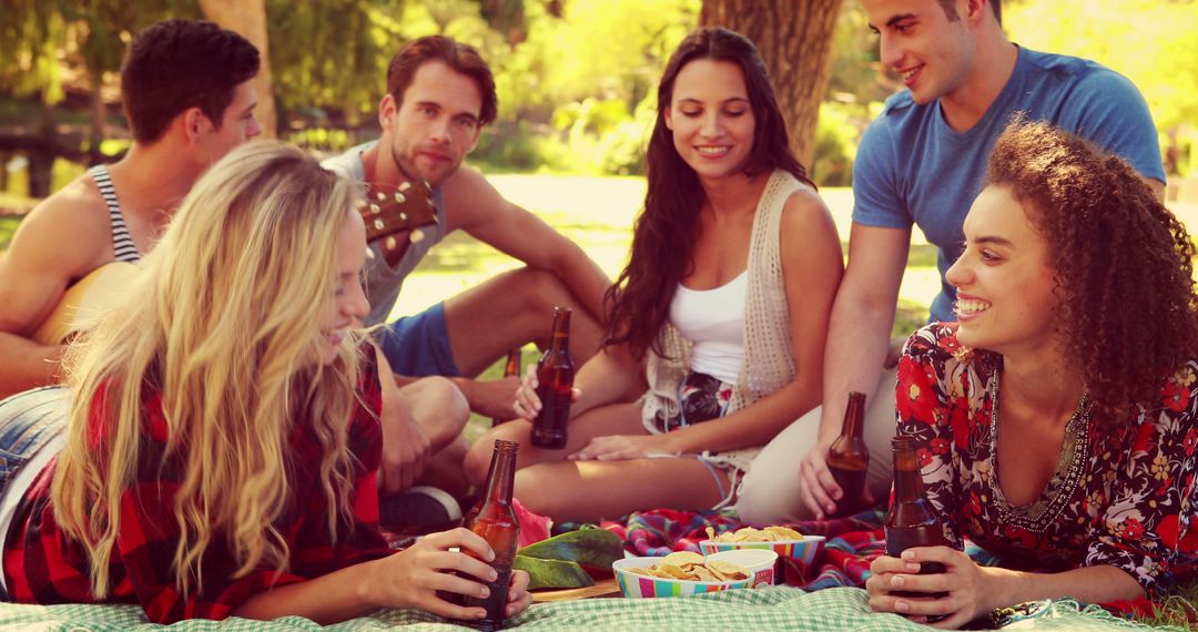 Young Adults Enjoying Outdoor Picnic in Sunny Park