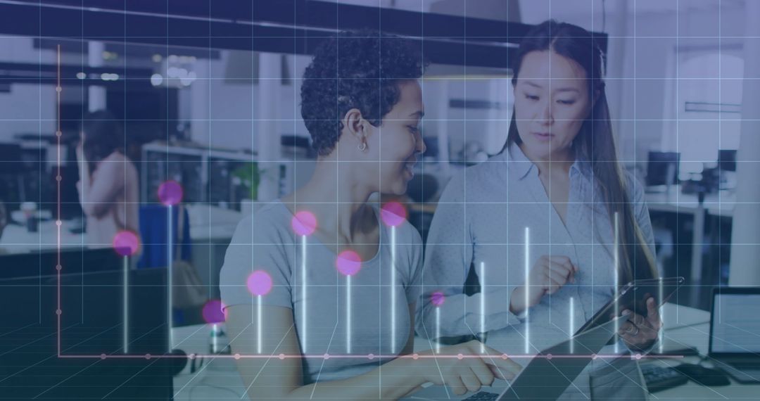 Diverse Female Colleagues Collaborating with Digital Data Overlay