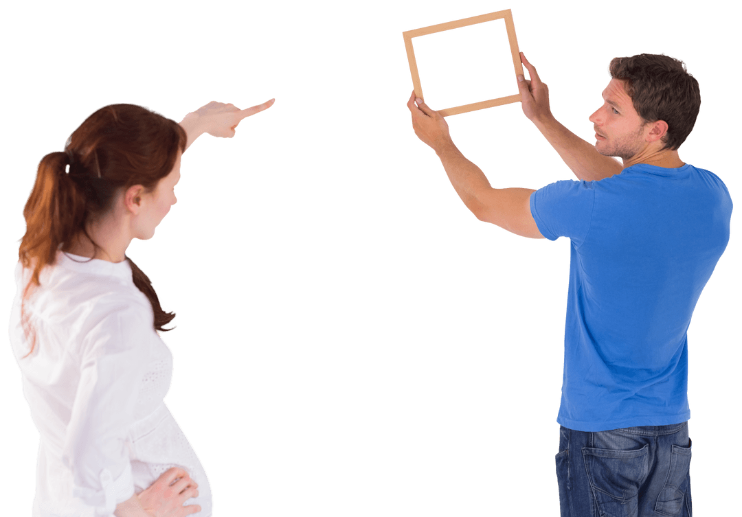 Creative Couple Deciding Picture Placement on Transparent Background