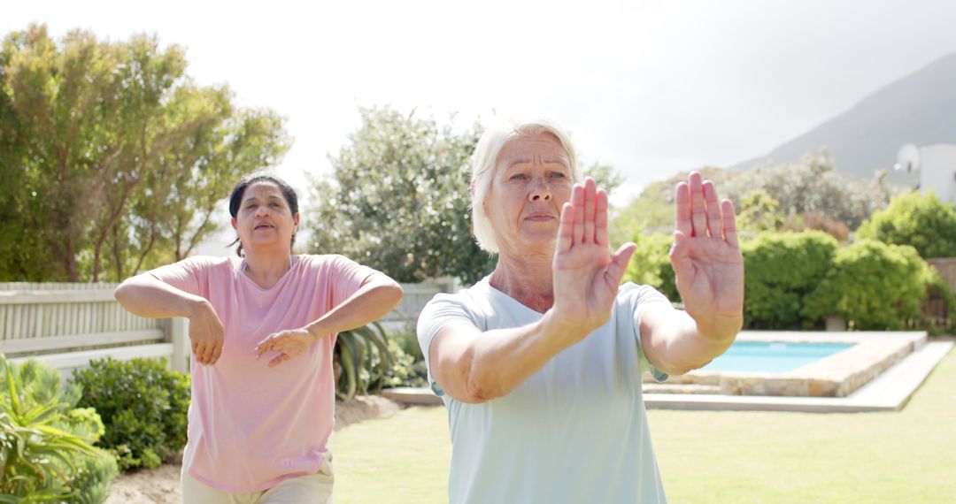 Senior Women Practicing Yoga in Sunny Garden Setting - Free Images, Stock Photos and Pictures on Pikwizard.com