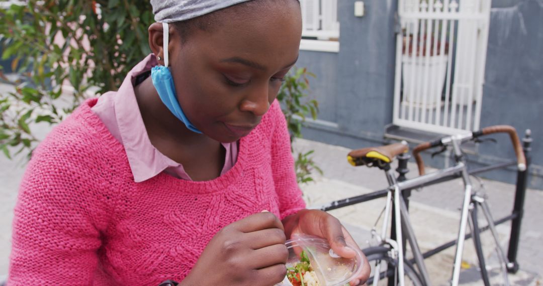 Young Woman Eating Healthy Meal Outside Urban Building - Free Images, Stock Photos and Pictures on Pikwizard.com