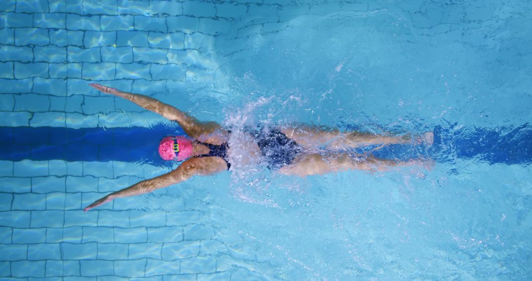 Female Swimmer Doing Backstroke in Swimming Pool - Free Images, Stock Photos and Pictures on Pikwizard.com