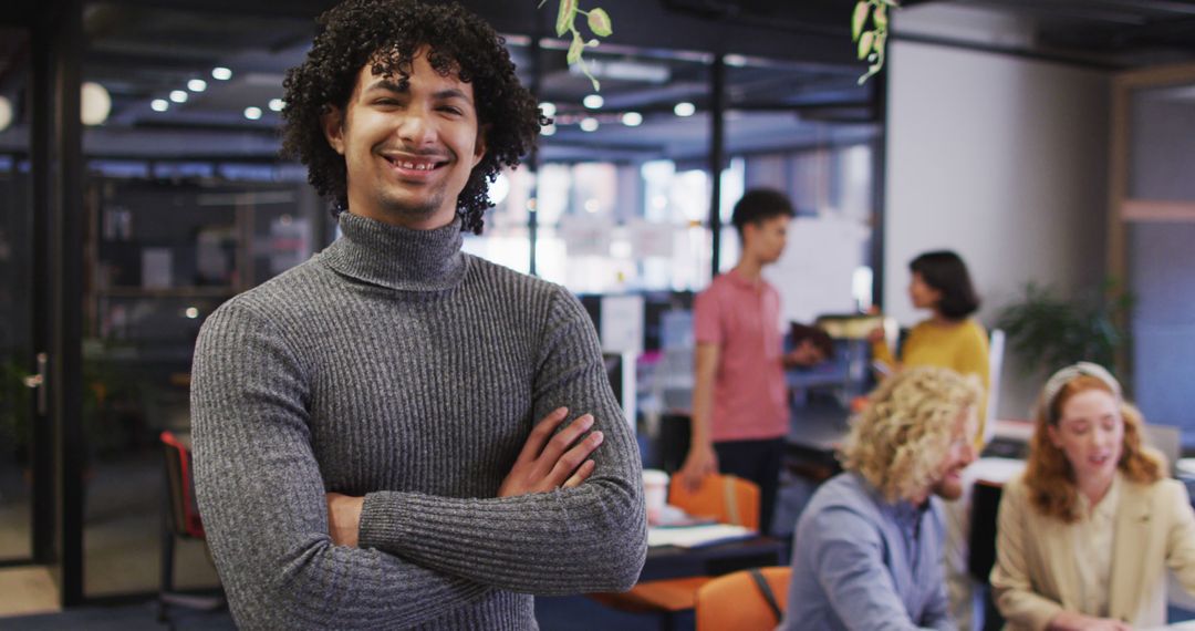 Portrait of happy biracial businessman with arms crossed at office - Free Images, Stock Photos and Pictures on Pikwizard.com