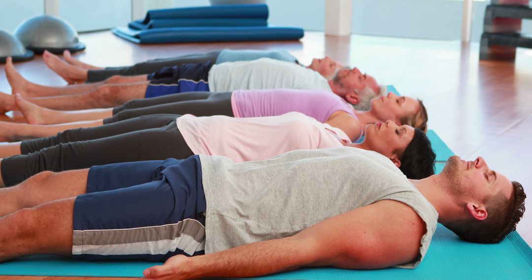 Group of Diverse Adults Participating in Yoga Class in Gym - Free Images, Stock Photos and Pictures on Pikwizard.com