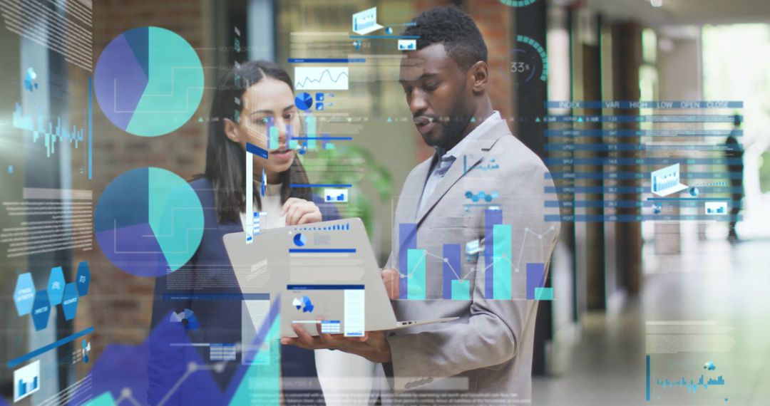 Business Consultants Analyzing Documents and Data on Laptop