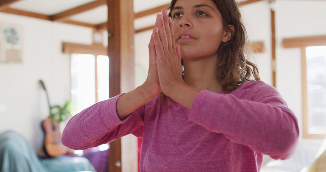 Woman Practicing Yoga at Home with Hands in Prayer - Free Images, Stock Photos and Pictures on Pikwizard.com