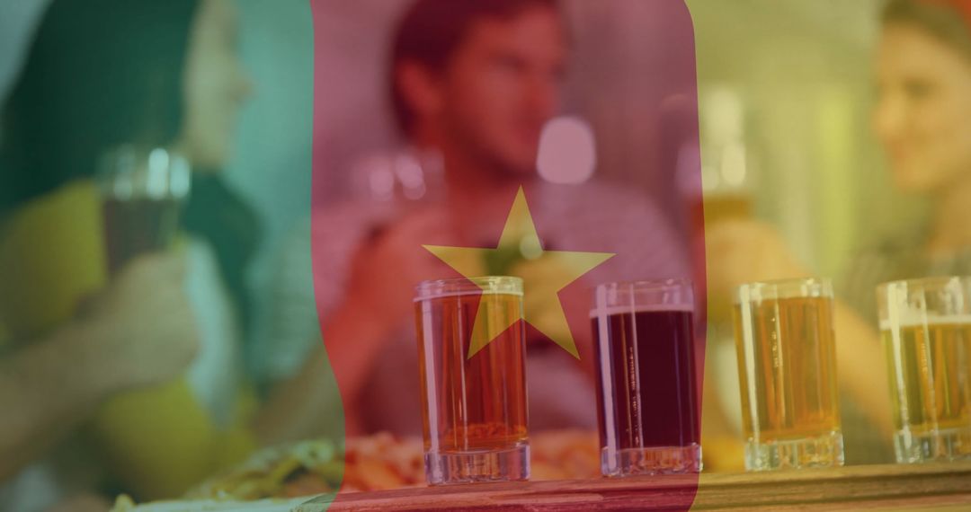 Friends Toasting Beer with Cameroon Flag Overlay in Rustic Pub Setting