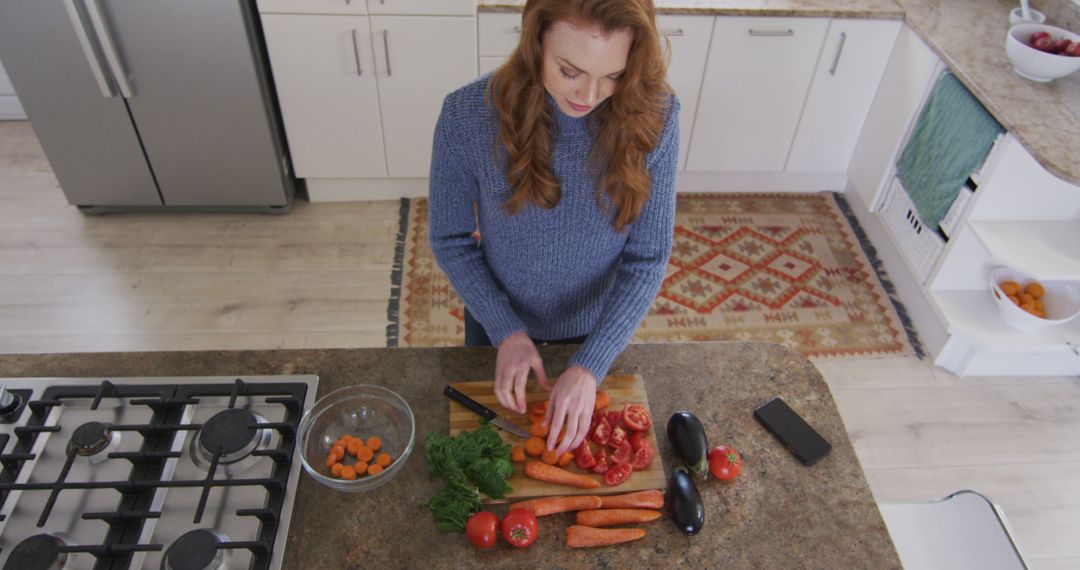 Woman Preparing Fresh Vegetables in Modern Kitchen from Above - Free Images, Stock Photos and Pictures on Pikwizard.com