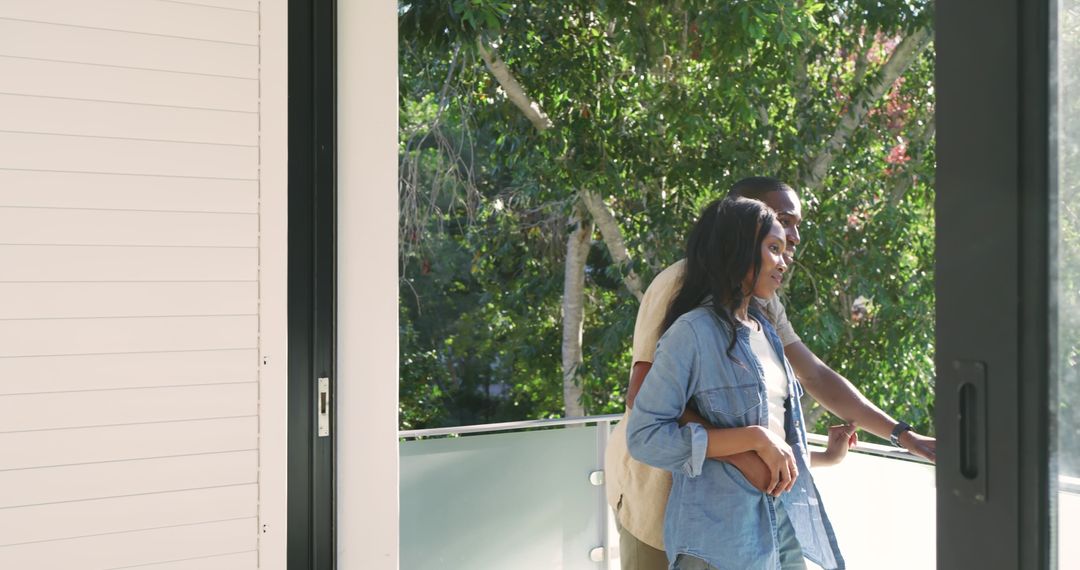 Friends Enjoying Scenic Balcony View in Urban Setting