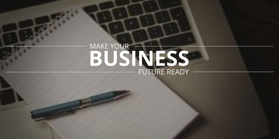 Notepad, Pen, and Laptop Enhancing Business Concept