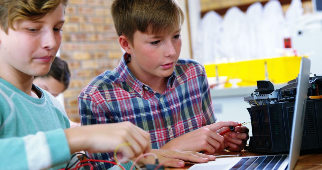 Schoolboys Engaged in Electronics Project at School Classroom