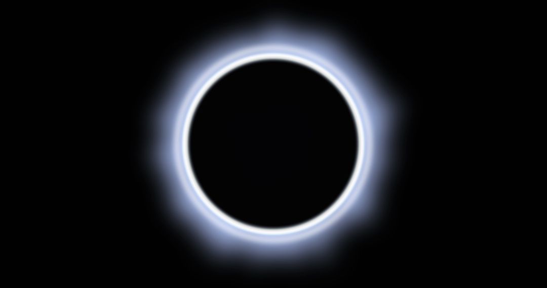 Luminous Eclipse with White Halo on Black Background