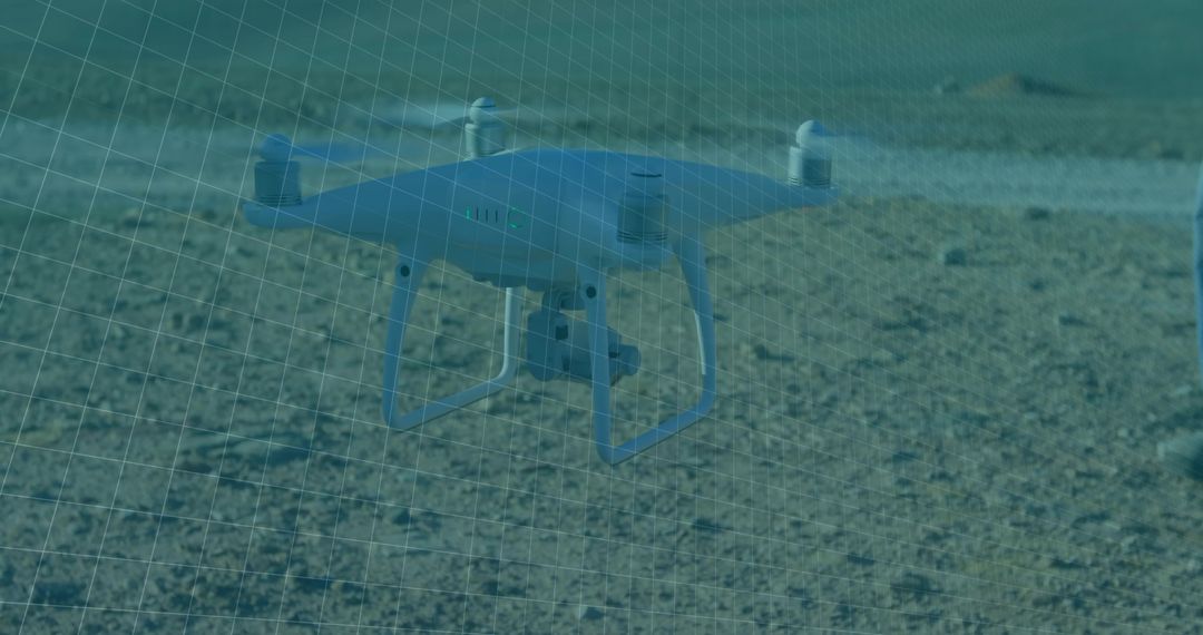 Quadcopter Drone Hovering Over Barren Landscape with Grid Overlay