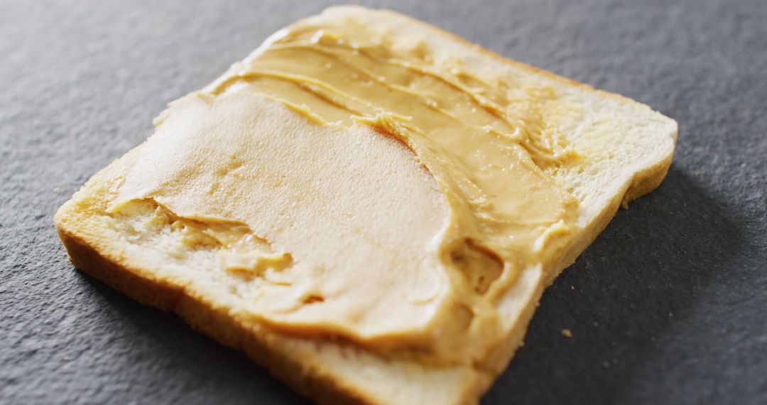 Creamy Peanut Butter Spread on Toast Slice