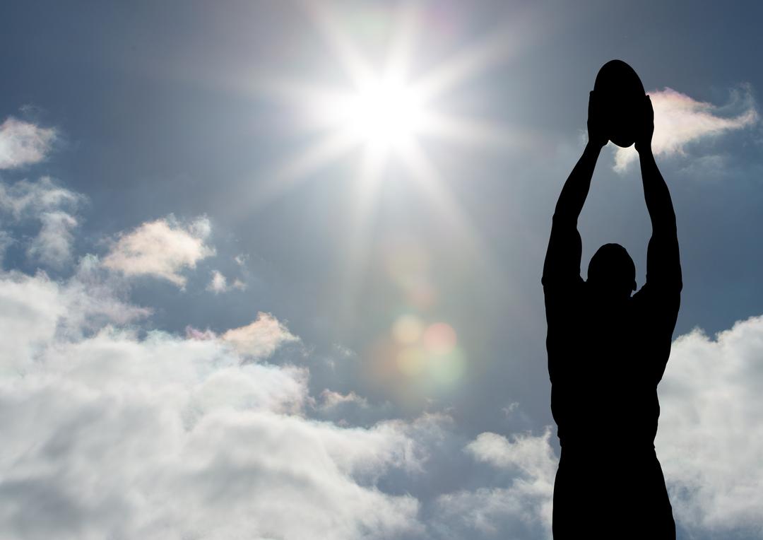 Silhouette of Male Rugby Player Catching Ball Against Bright Sun - Free Images, Stock Photos and Pictures on Pikwizard.com