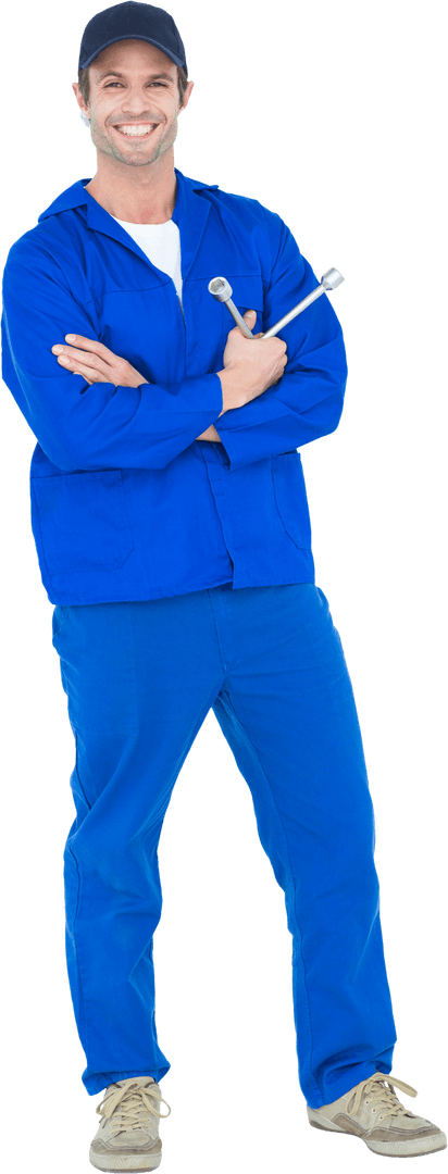 Smiling Mechanic in Blue Uniform Holding Wrenches Transparent Background