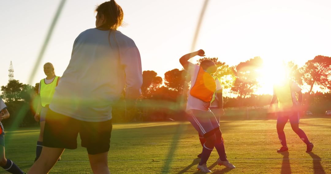 Women Playing Soccer During Sunset on Field - Free Images, Stock Photos and Pictures on Pikwizard.com