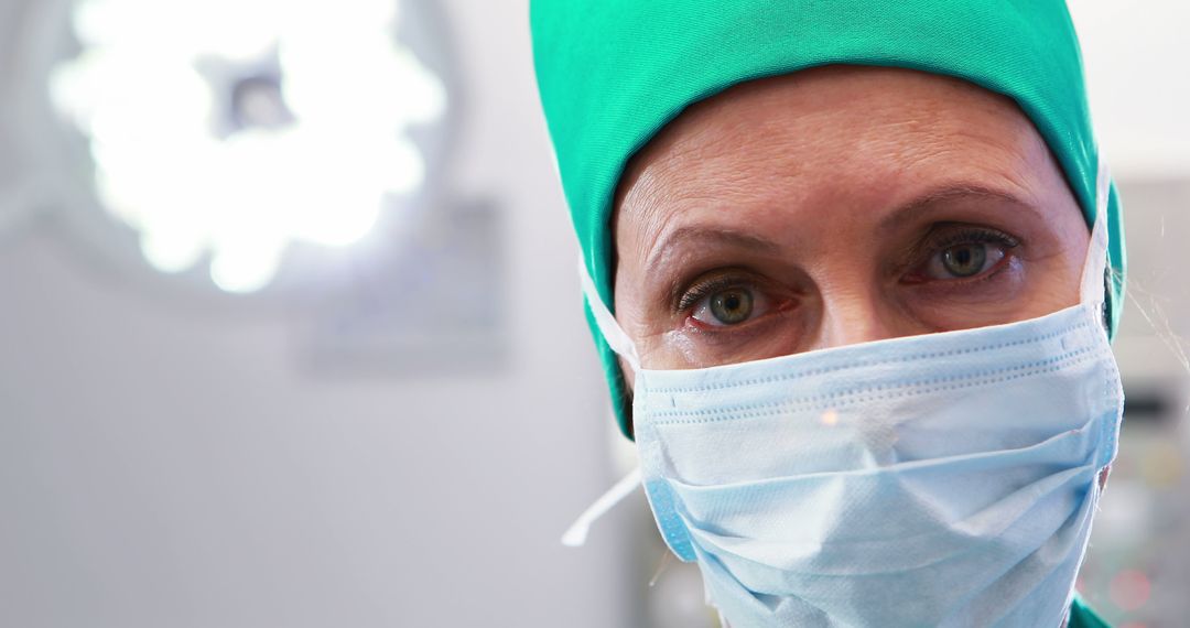 Portrait of female nurse in surgical mask at operation theater - Free Images, Stock Photos and Pictures on Pikwizard.com