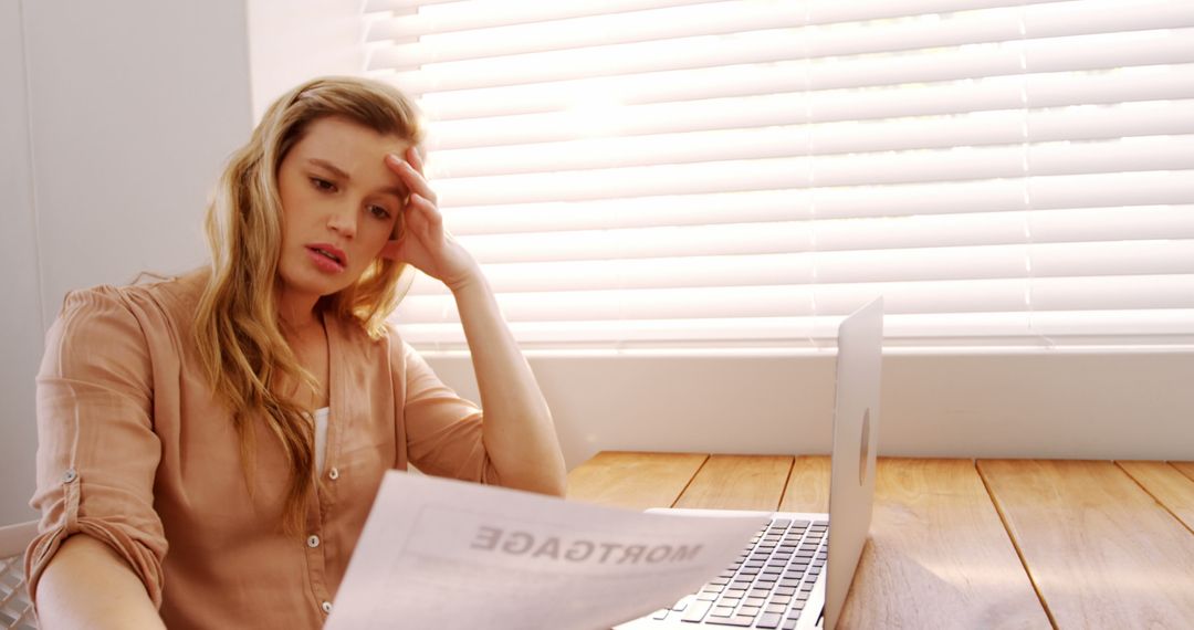 Stressed Woman Reviewing Mortgage Documents in Home Office - Free Images, Stock Photos and Pictures on Pikwizard.com