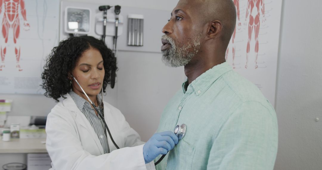 Doctor Examining Adult Male Patient with Stethoscope in Medical Clinic - Free Images, Stock Photos and Pictures on Pikwizard.com