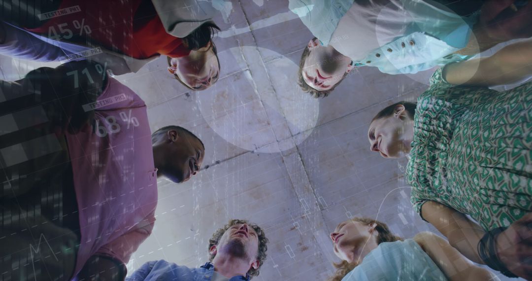 Diverse Team Collaborating with Virtual Data Graphics