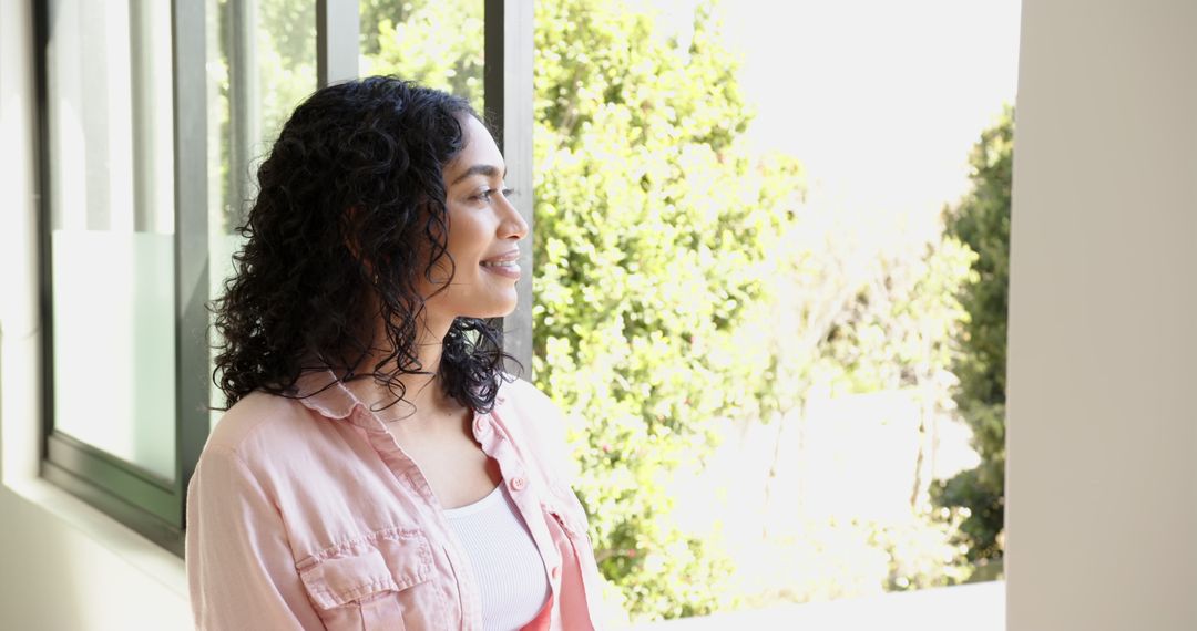 Woman Enjoying Tranquil View Through Window