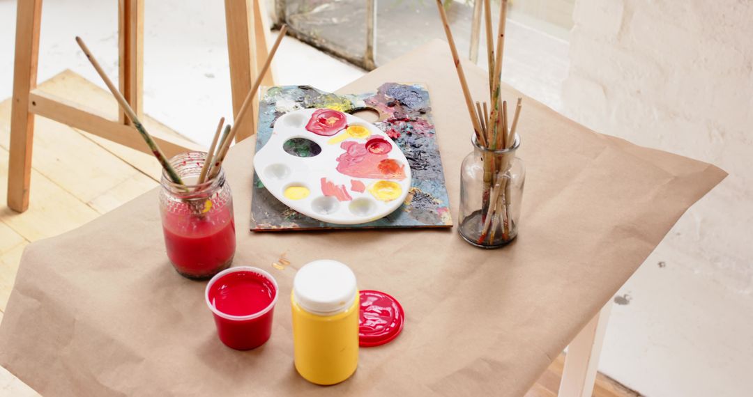 Creative Art Workspace with Paint Supplies by Window