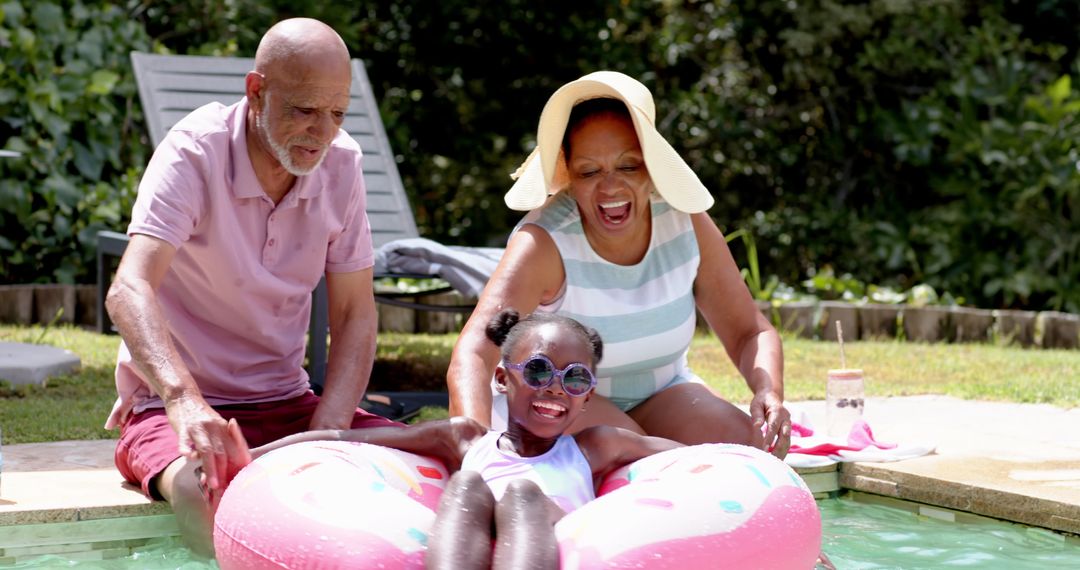Happy Family Enjoying Pool Time with Child on Inflatable Float