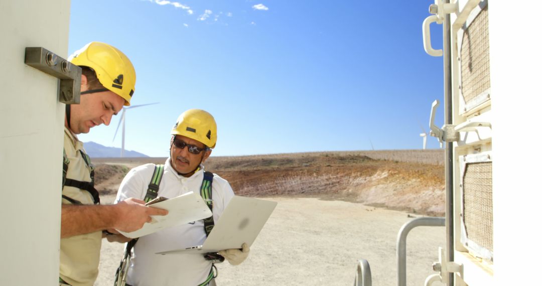 Engineers Working on Renewable Energy Project with Tablets and Laptops - Free Images, Stock Photos and Pictures on Pikwizard.com