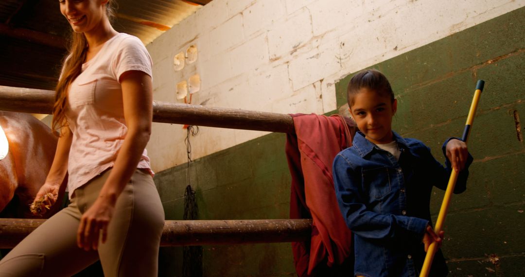 Mother and Daughter Caring for Horses in Stable - Free Images, Stock Photos and Pictures on Pikwizard.com