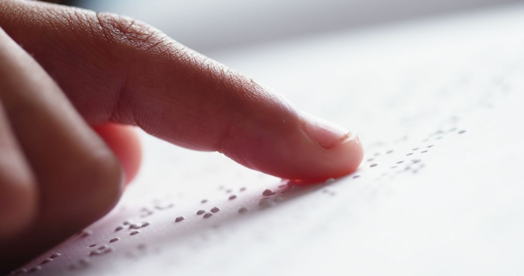 Close-up of Finger Reading Braille Text on White Paper - Free Images, Stock Photos and Pictures on Pikwizard.com