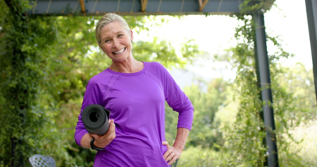 Elderly Woman Holding Yoga Mat Ready for Outdoor Exercise