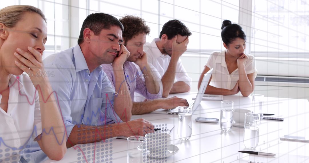 Exhausted Colleagues Analyzing Data in Organizational Meeting