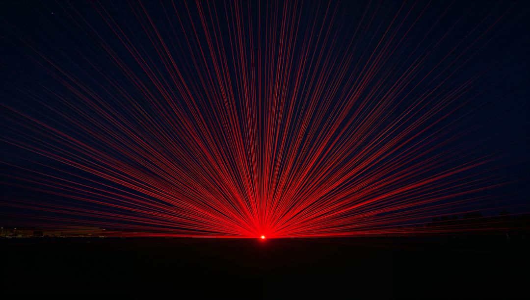 Radiating Red Starburst Laser Beams Over Dark Horizon Casting Radial Light Across Field