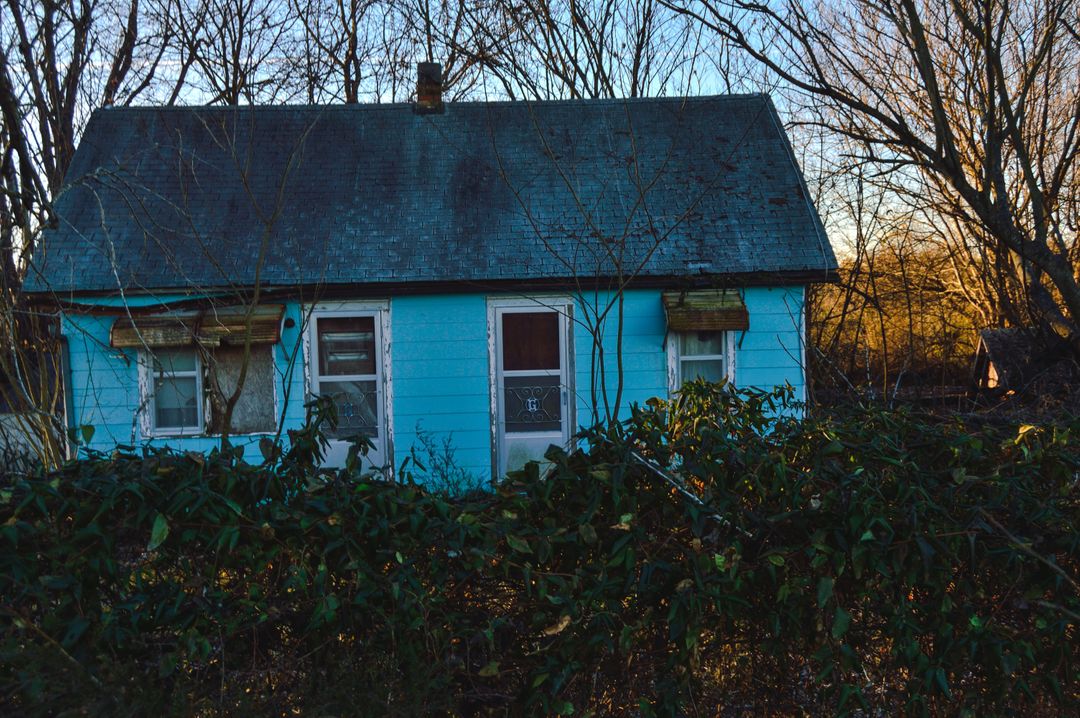 Abandoned Blue House in Overgrown Yard at Dusk - Free Images, Stock Photos and Pictures on Pikwizard.com