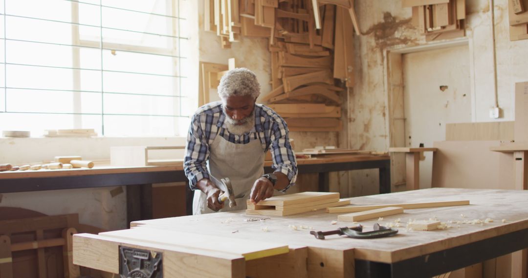 Senior Craftsman Woodworking in Sunlit Workshop - Free Images, Stock Photos and Pictures on Pikwizard.com