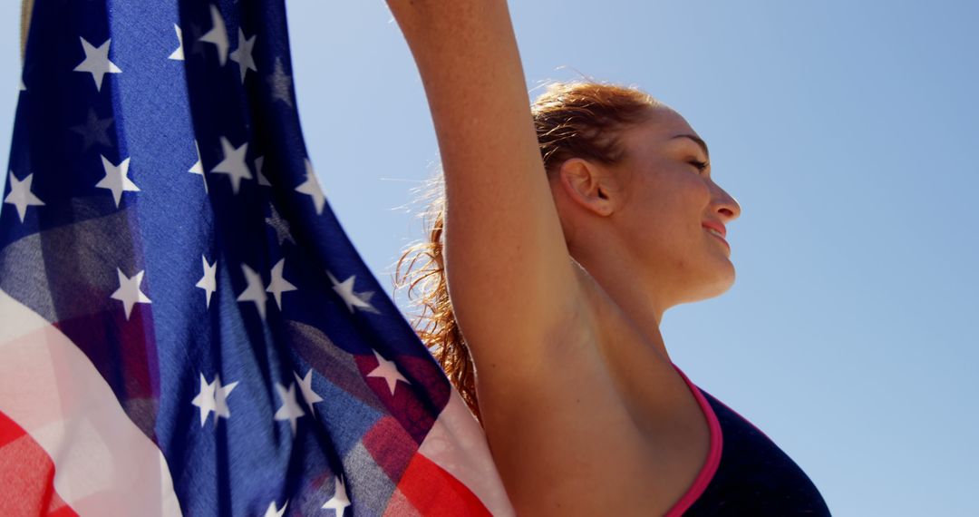 Woman Celebrating with USA Flag in Sunny Summer Weather - Free Images, Stock Photos and Pictures on Pikwizard.com