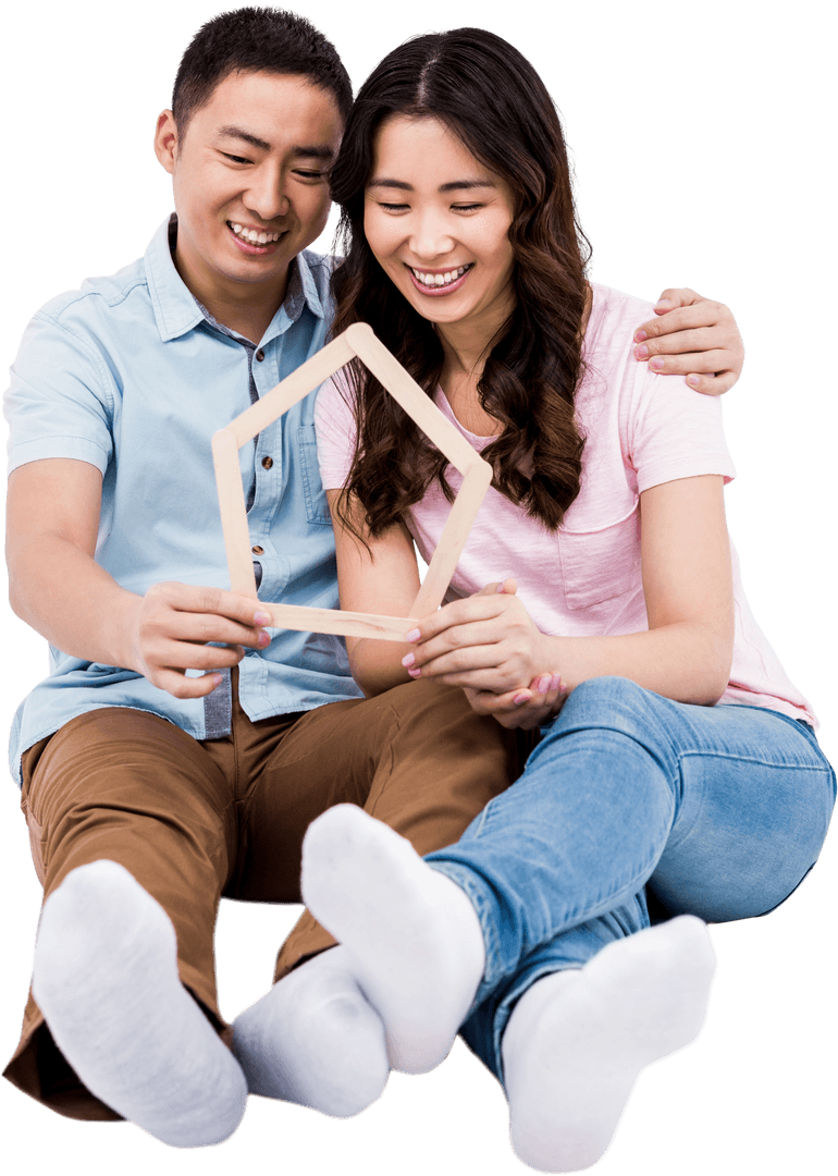 Smiling Couple Holding Transparent Wooden House Frame