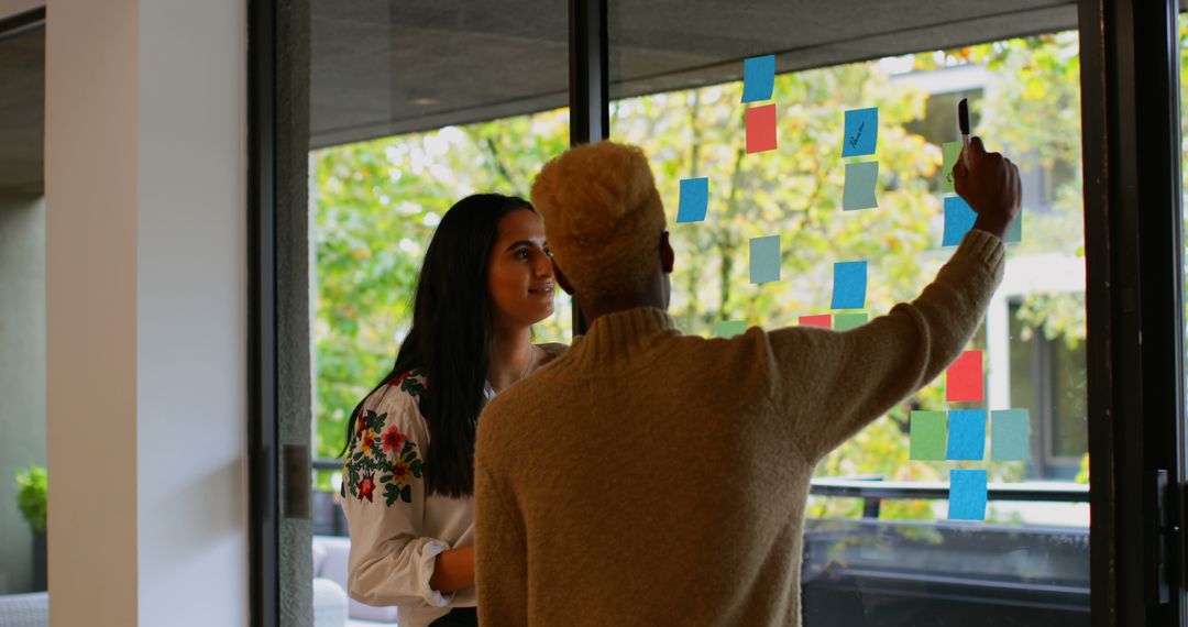 Team Brainstorming New Ideas with Sticky Notes in Office - Free Images, Stock Photos and Pictures on Pikwizard.com