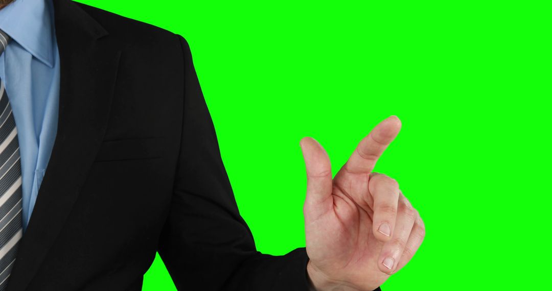 Businessman pointing finger on green chroma key background - Free Images, Stock Photos and Pictures on Pikwizard.com