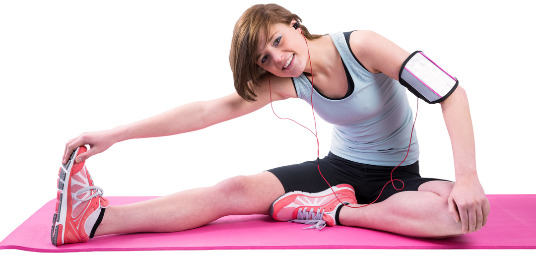 Woman Stretching on Pink Exercise Mat with Earphones - Download Free Stock Images Pikwizard.com