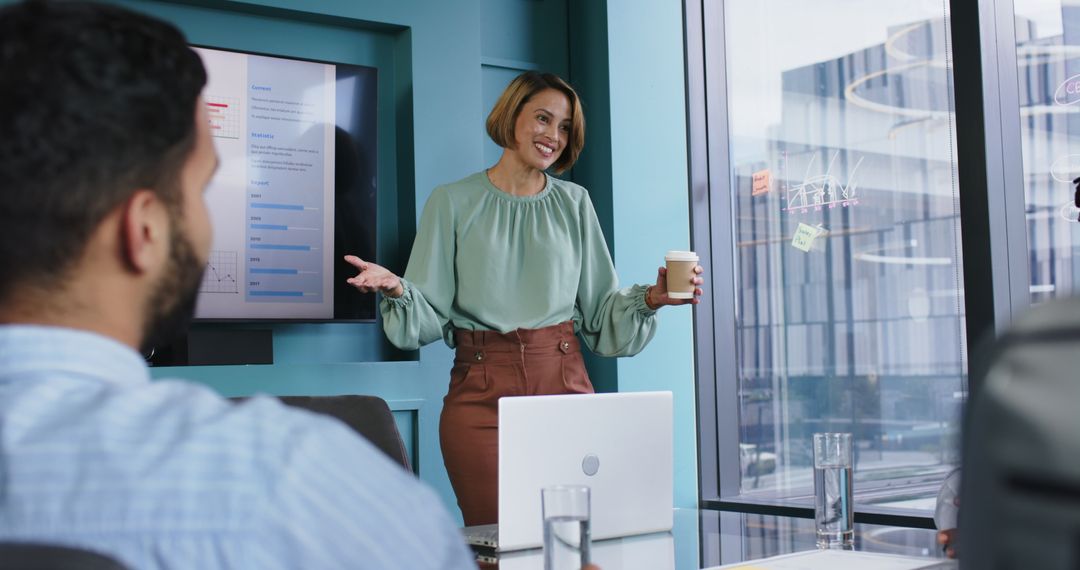 Woman Leading Team Meeting Presentation in Modern Office