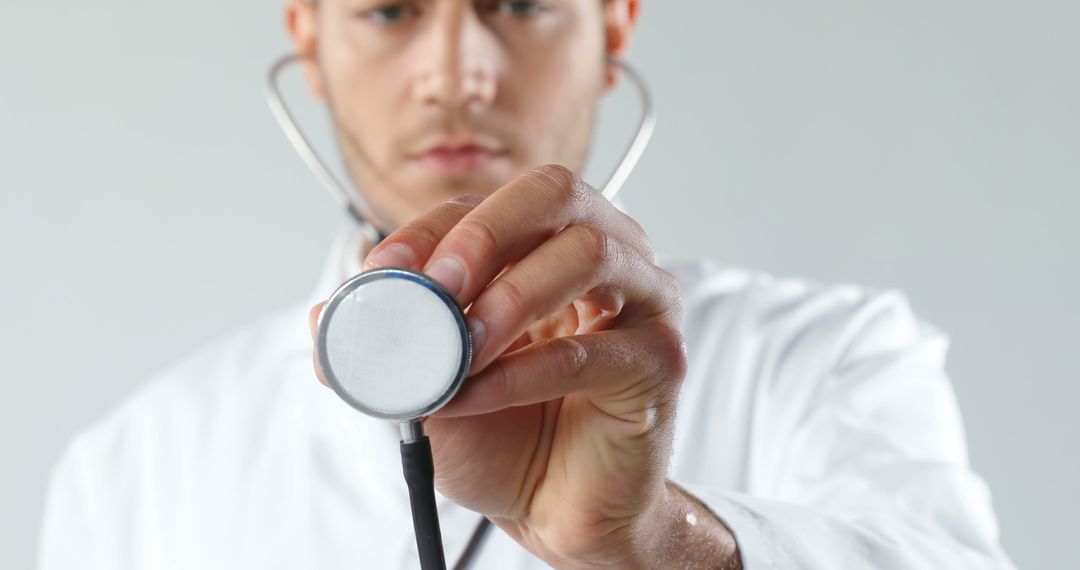 Doctor Holding Stethoscope in Medical Examination - Free Images, Stock Photos and Pictures on Pikwizard.com