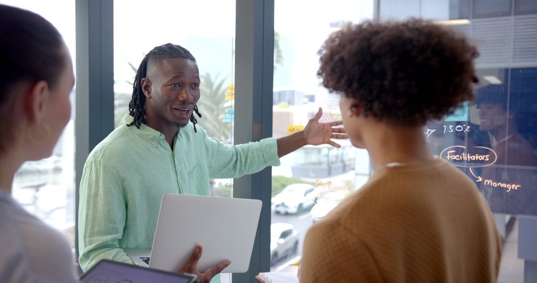 Business Team Discussing Strategy with Technology in Office Meeting
