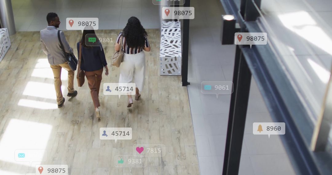 Diverse Team Navigates Digital Notifications in Office Environment